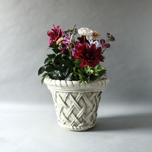Ornate planter with classical old world European lattice pattern and braided rim, featuring a weathered, antique finish. Side Angle