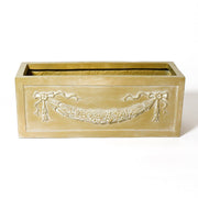 Rectangular planter box with ornate Baroque-style garland and ribbon relief, featuring classical old world European detailing. Different Angle