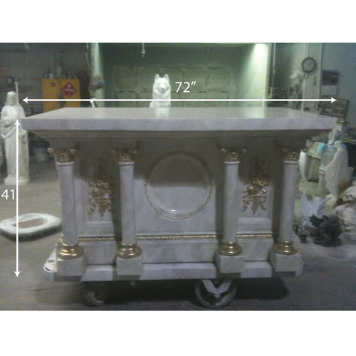 Classical altar with ornate Baroque columns, gold accents, and a central medallion, featuring old world European architectural details.