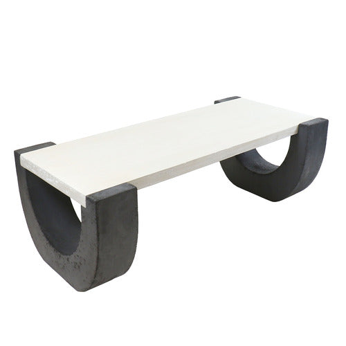 Rectangular coffee table with classical minimalist design, featuring thick, curved legs and a clean, architectural silhouette. Side Angle