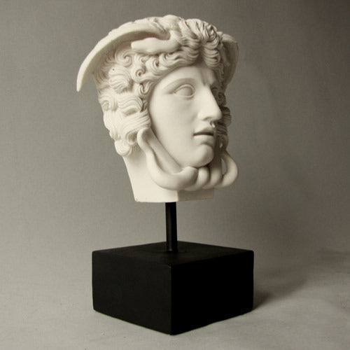 Medusa head sculpture with classical Greek and ornate Baroque details, featuring serpentine hair and dramatic facial expression. Side Angle