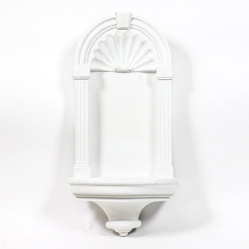 Saint statue in classical niche with ornate arch, old world European style, featuring Renaissance and Baroque detailing. Side Angle