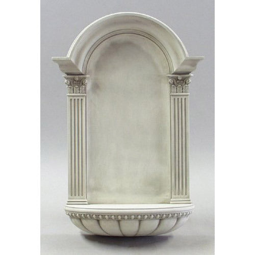 Wall niche with arched top, fluted columns, ornate Corinthian capitals, and classical old world European architectural detailing.