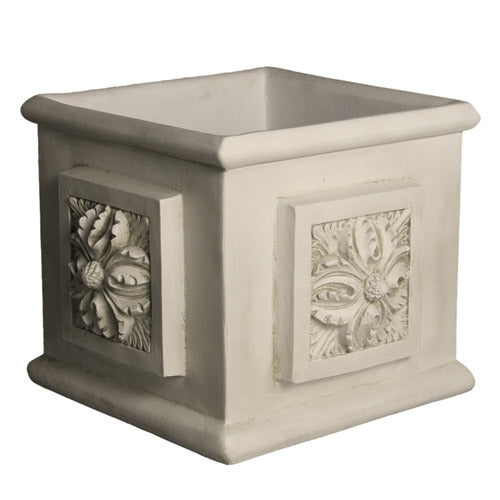 Square planter with ornate classical relief panels featuring intricate old world European floral and leaf motifs on each side.