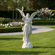 Winged angel statue in classical Renaissance style, holding a torch aloft, with flowing drapery and ornate detailing. Side Angle