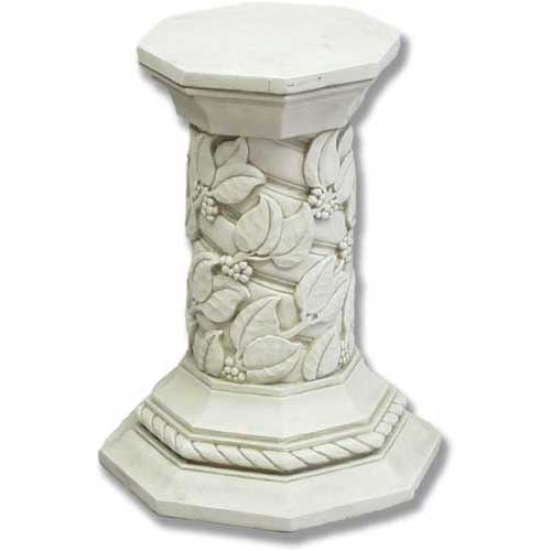 Ornate pedestal with octagonal base and top, featuring classical old world European leaf and berry relief in a Renaissance style.