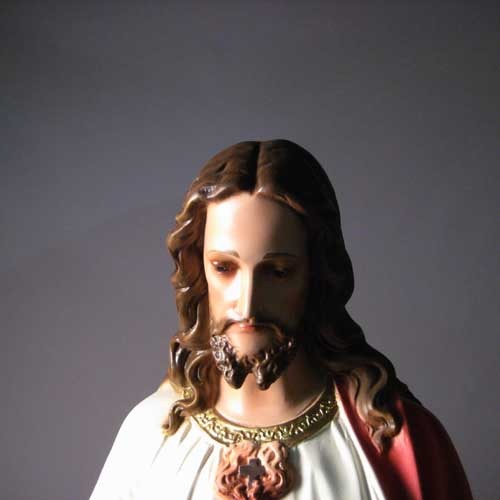 Sacred Heart of Jesus statue in classical Renaissance style, featuring ornate robes and detailed facial expression, standing on a pedestal. Additional Angle
