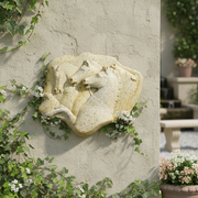 Relief sculpture featuring three horses in a classical, old world European style with ornate, Renaissance-inspired detailing. Side Angle