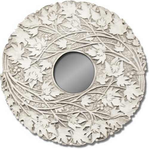 Round mirror framed by ornate, old world European-style carved leaves and vines in a classical, nature-inspired design.