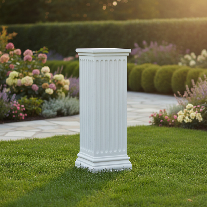 Classical Greek pedestal with fluted column design and ornate stepped base, evoking old world European architectural style. Side Angle