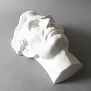 Classical bust sculpture with detailed facial features and stylized hair, inspired by Renaissance and old world European artistry Side Angle