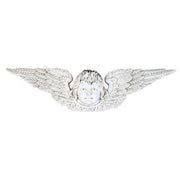 Winged cherub face with ornate, detailed feathers in a classical Baroque style, evoking old world European architecture. Side View