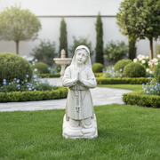 Kneeling girl statue with hands in prayer, rosary draped over wrists, featuring classical old world European style and serene expression. Side Angle