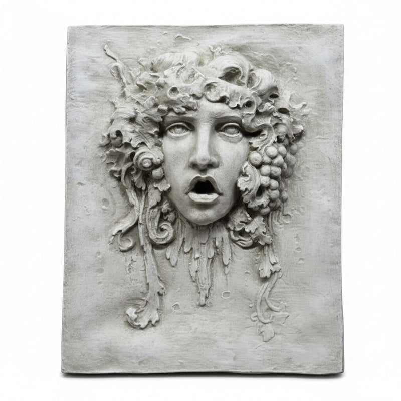 Medusa wall plaque with classical Greek and ornate Baroque detailing, featuring flowing hair, grape clusters, and expressive facial features