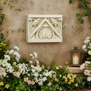 Architectural block with ornate old world European leaf motifs and classical triangular pediment in a Renaissance style. Side Angle