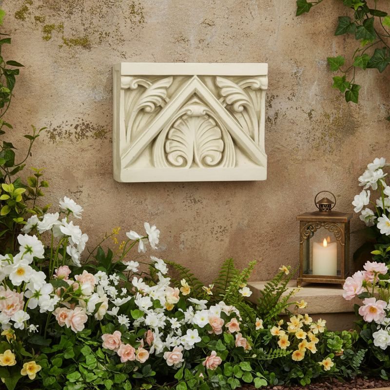 Architectural block with ornate old world European leaf motifs and classical triangular pediment in a Renaissance style. Side Angle