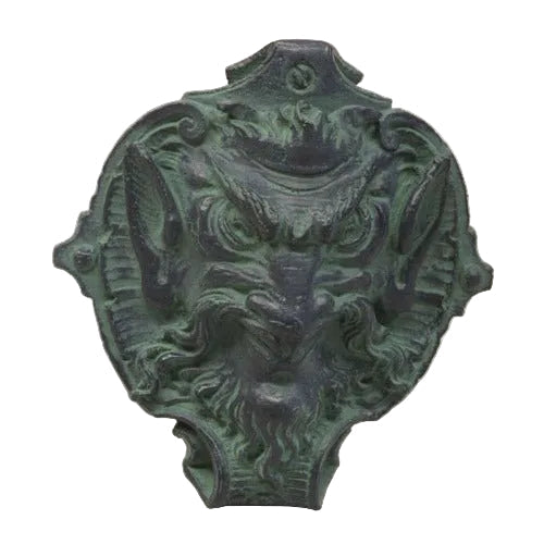 Grotesque face door knocker with ornate detailing, old world European style, featuring classical and Baroque influences.