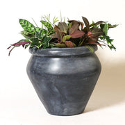 Classical old world European urn with a wide rim and tapered base, featuring a simple, understated, and timeless silhouette. Side Angle