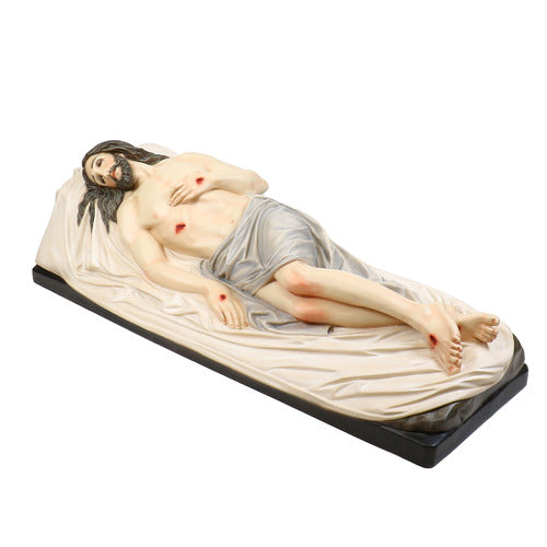 Reclining figure of Christ with classical Renaissance detailing, draped in cloth, featuring ornate, old world European styling. Side View