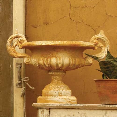 Ornate classical urn with elaborate handles and pedestal base, featuring old world European and Baroque decorative details. Side Angle
