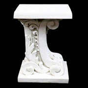 Ornate pedestal table with classical Baroque scrollwork and intricate old world European detailing on a square base and top. Side Angle