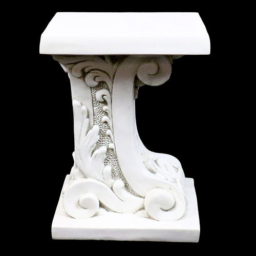 Ornate pedestal table with classical Baroque scrollwork and intricate old world European detailing on a square base and top. Side Angle