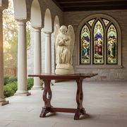 Kneeling angel statue with folded arms, detailed wings, and flowing robes in an old world European classical style. Side Angle