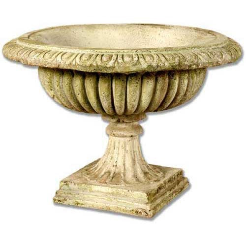 Ornate classical urn with fluted bowl, scalloped rim, and pedestal base in old world European Renaissance style.