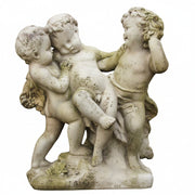 Baroque-style sculpture of three playful cherubs in a dynamic, ornate composition with classical European detailing.