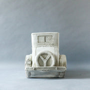 Vintage car sculpture with old world European charm, featuring ornate classical detailing and a nostalgic, early 20th-century design. Side Angle
