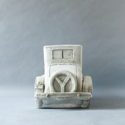 Vintage car sculpture with old world European charm, featuring ornate classical detailing and a nostalgic, early 20th-century design. Side Angle