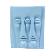 Abstract sculptural wall art featuring two elongated, stylized faces in a minimalist, classical European-inspired design. Side View