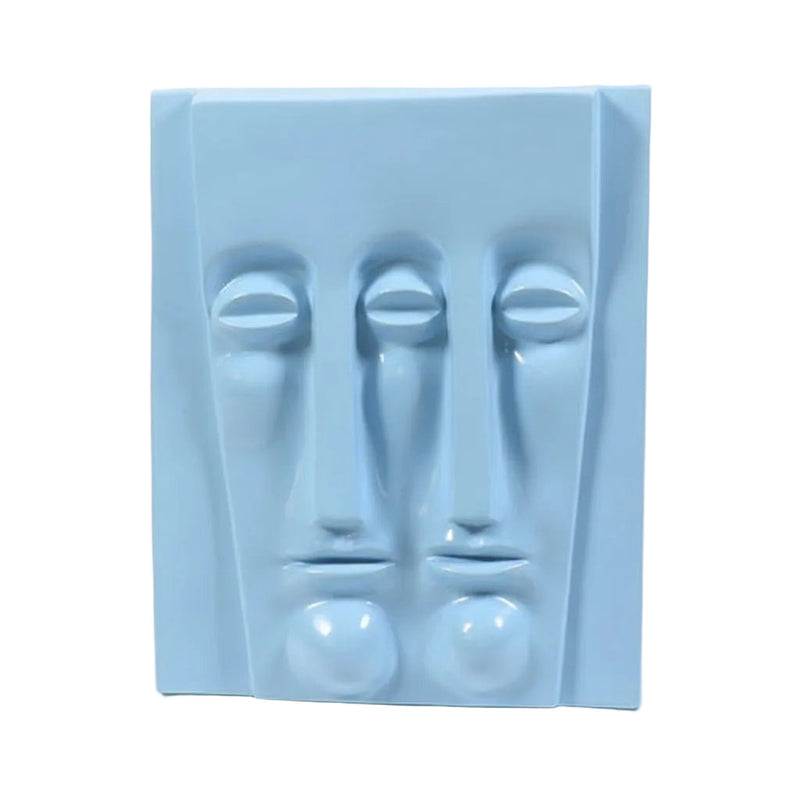Abstract sculptural wall art featuring two elongated, stylized faces in a minimalist, classical European-inspired design. Side View