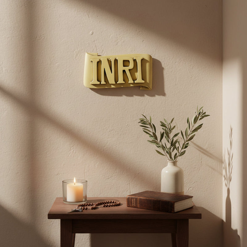 INRI plaque with bold, classical raised lettering on an ornate, scroll-shaped background in old world European style. Side Angle