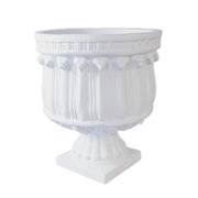 Ornate classical urn planter with fluted body, decorative relief details, and pedestal base in old world European style.