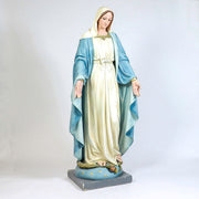 Virgin Mary statue in classical old world European style, standing with open arms on a pedestal adorned with stars and a serpent. Additional Angle