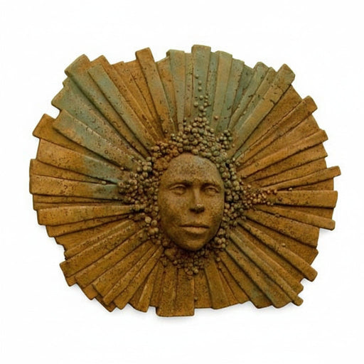 Sunburst wall sculpture with a classical face at the center, radiating ornate, old world European and Renaissance-inspired details.