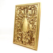 Ornate rectangular plaque with intricate Baroque scrollwork and classical old world European detailing in raised relief. Side View