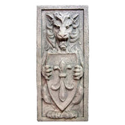 Lion relief sculpture in old world European style, holding a fleur-de-lis shield with ornate medieval and Gothic detailing. Side View