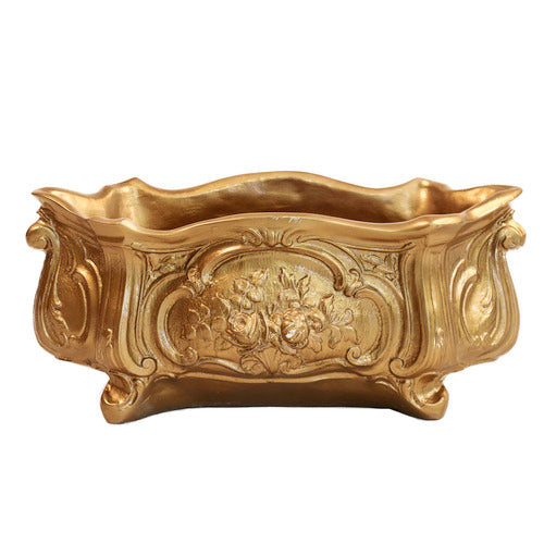 Ornate Baroque planter with intricate floral relief and curved, classical old world European design elements. Side Angle