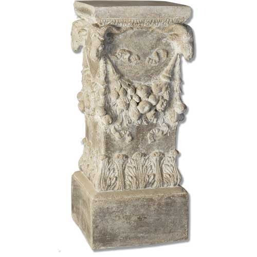 Ornate pedestal with classical old world European design, featuring carved garlands and acanthus leaf motifs in Renaissance style.