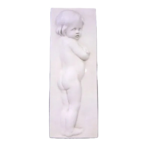 Classical bas-relief of a cherubic child in Renaissance style, standing in profile with delicate, ornate detailing.