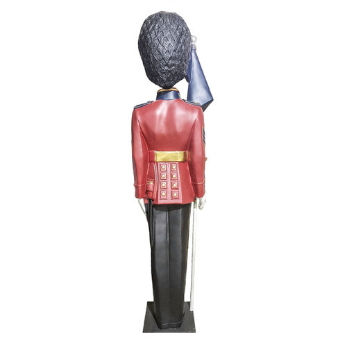 British royal guard statue in ornate old world European style uniform, tall bearskin hat, holding a flag, classical military theme Additional Angle