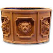 Ornate old world European planter with classical lion head reliefs in Baroque style panels and decorative architectural detailing.