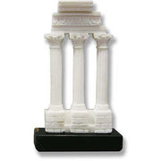 Classical Greek temple ruins with three ornate Corinthian columns and detailed entablature on a stepped base.