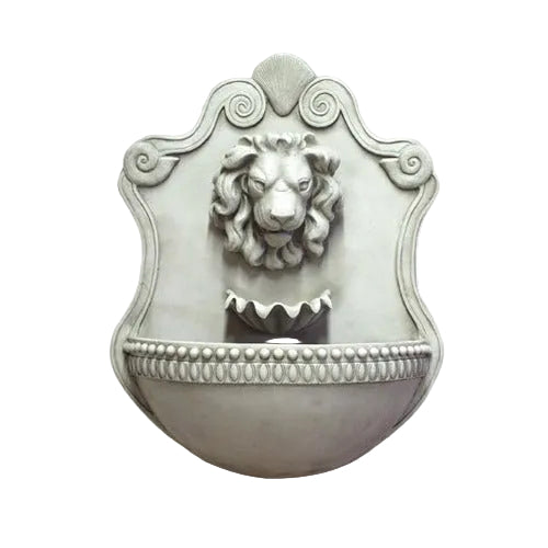 Lion head wall fountain with ornate old world European detailing and classical Baroque shield-shaped backplate.