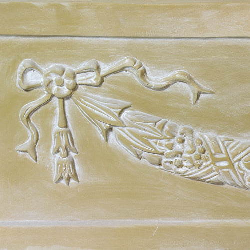 Rectangular planter box with ornate Baroque-style garland and ribbon relief, featuring classical old world European detailing. Side Angle