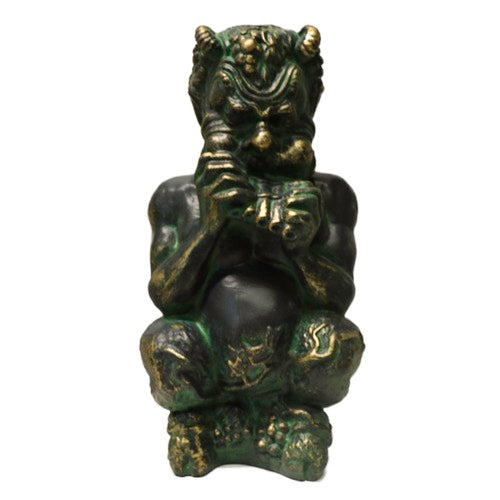 Grotesque satyr statue in classical old world European style, featuring ornate facial details and pan flute, inspired by Renaissance art. Side Angle