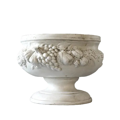 Ornate classical pedestal bowl with Baroque fruit and floral relief, featuring old world European decorative detailing.