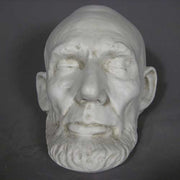 Classical old world European sculpted head with closed eyes, detailed facial features, and a prominent beard in Renaissance style. Additional Angle